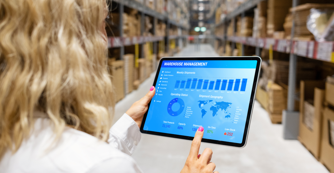 SME team using digital tools in a logistics and office environment, with laptops and tablets, representing accessible digitalisation and operational efficiency.